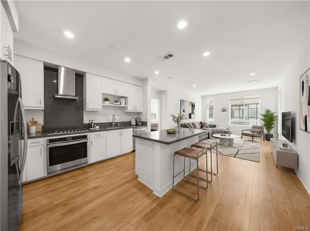 2402 Nolita — open-concept living room with natural light