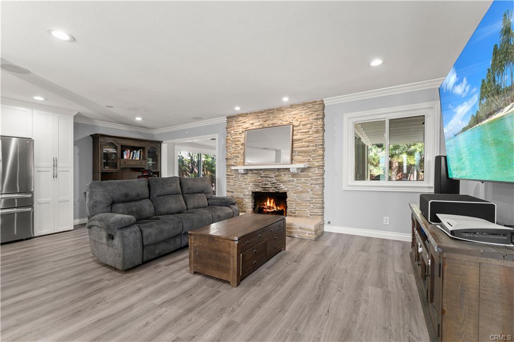 1170 Gleneagles — living room with stone fireplace and surround-sound ceiling speakers