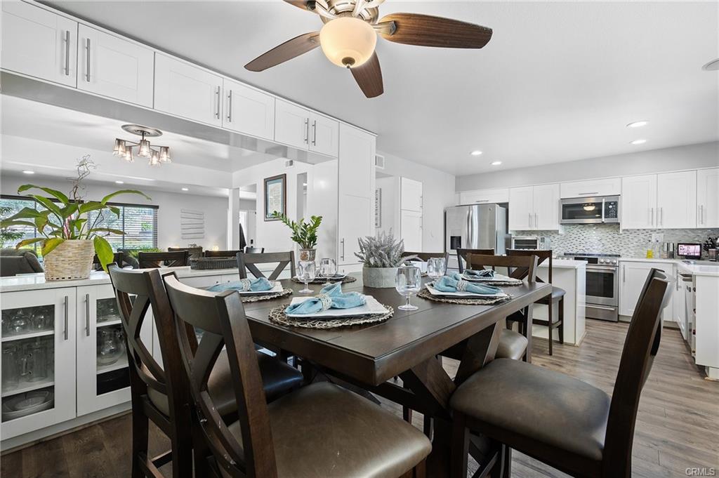 18126 Sand Dunes Ct — formal dining area open to the kitchen and built-in china cabinet