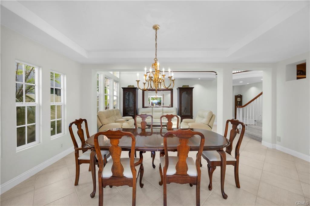 9112 Playa Dr — formal dining room with chandelier