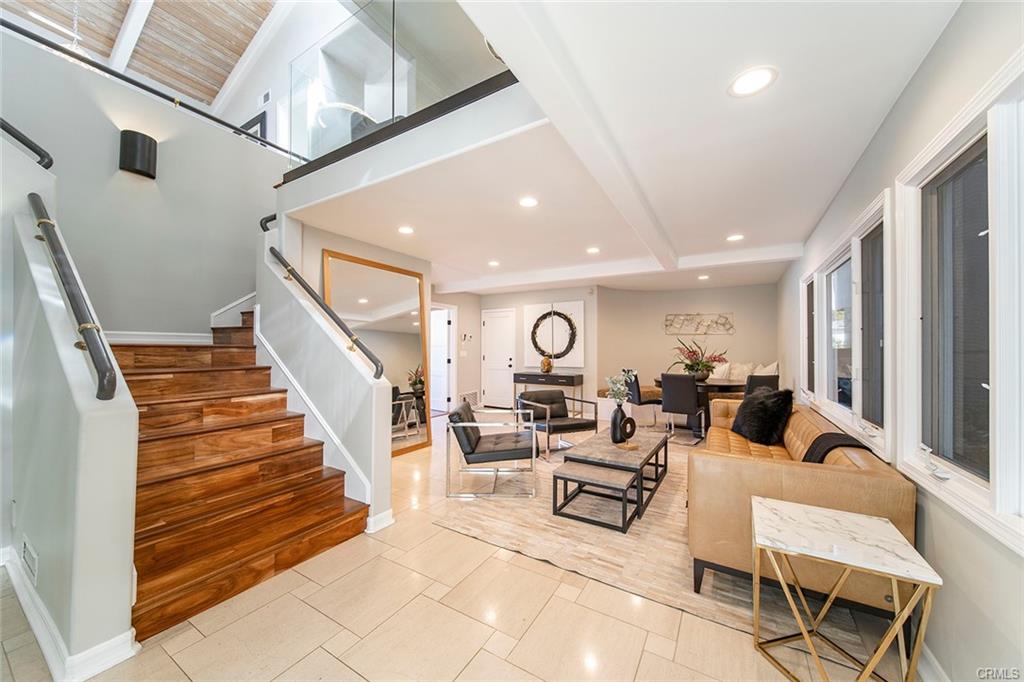 6063 Lido Ln — entry, staircase, and formal living area
