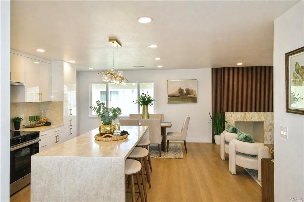 9142 Parliament Ave — kitchen island seating open to the dining area