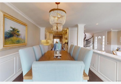 16143 Saint Croix — formal dining room with chandelier open to the great room