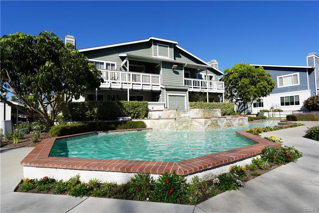 16440 Atherton St #26 — community pool and spa surrounded by mature landscaping