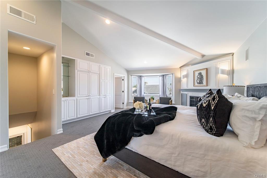 6063 Lido Ln — primary suite with vaulted ceilings