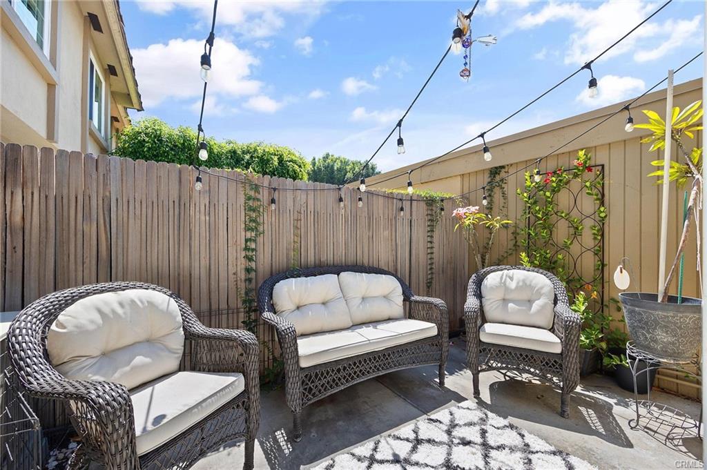 18126 Sand Dunes Ct — private patio with lounge seating and string lighting