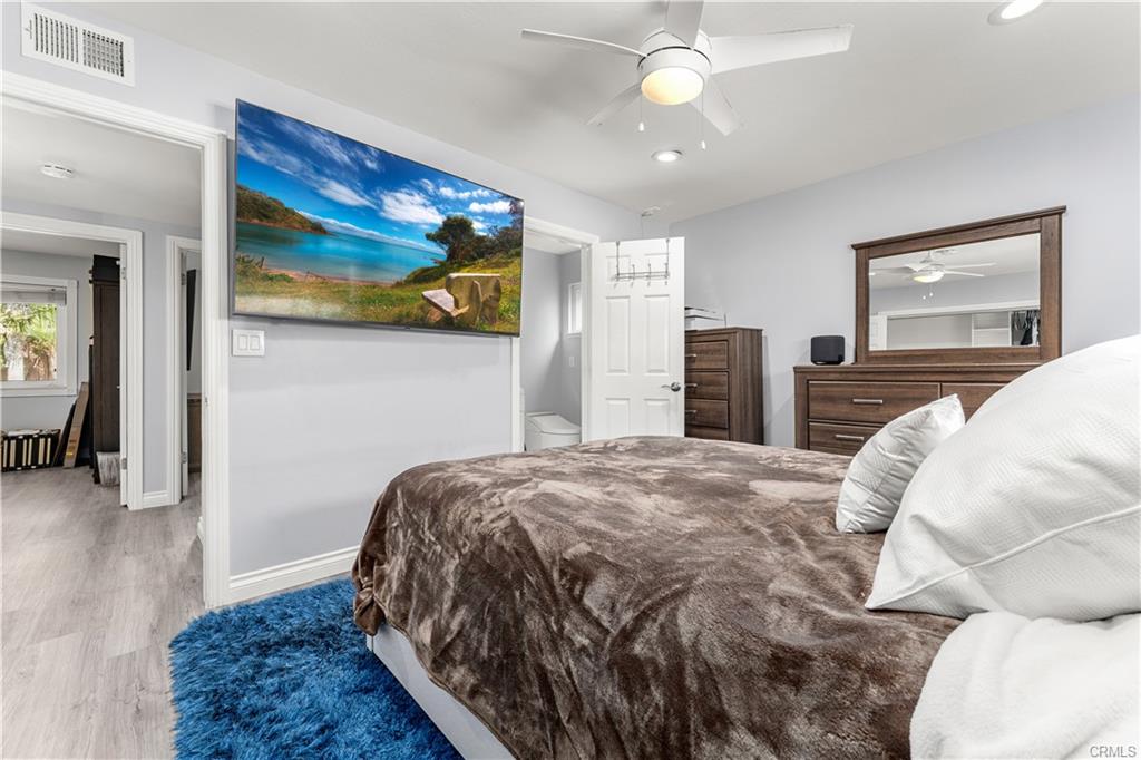 1170 Gleneagles — primary bedroom with vaulted ceiling and fresh finishes
