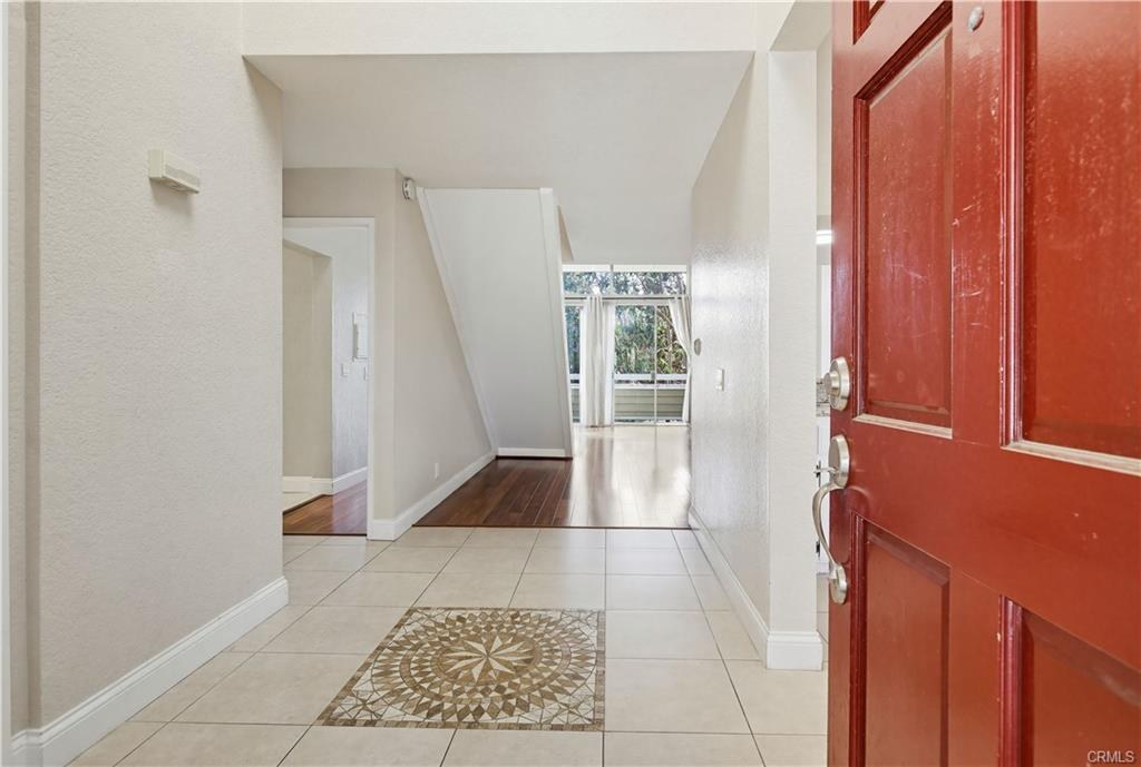 3650 S Bear St #77 — entry with signature red front door