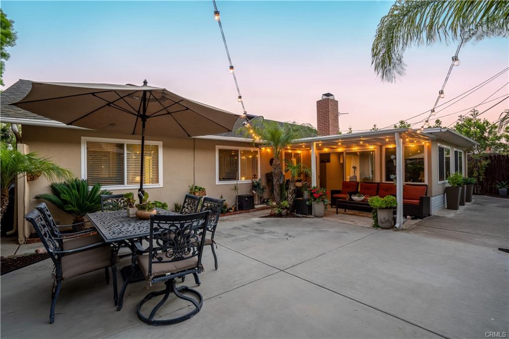 1170 Gleneagles — landscaped backyard at twilight with patio dining