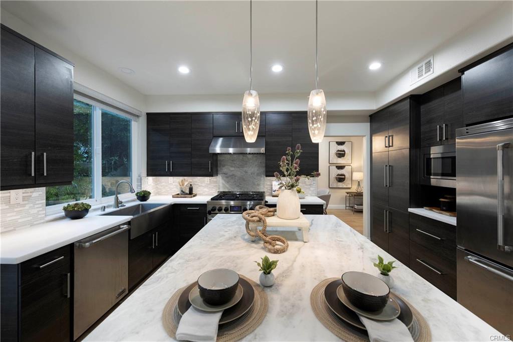 43 Lessay — custom chef's kitchen with bespoke cabinetry and premium counters