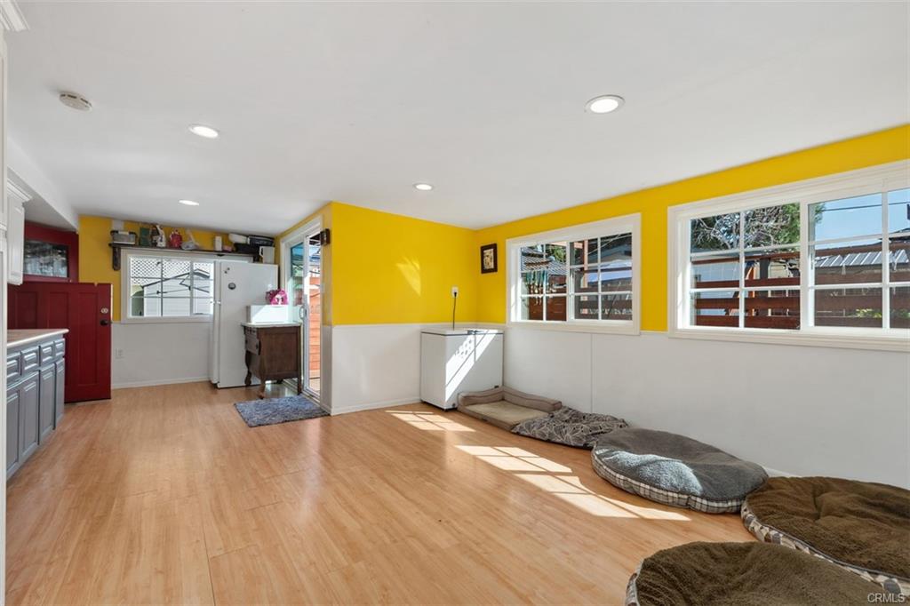 20292 Riverside Dr — interior kennel room with dog beds and easy-clean flooring