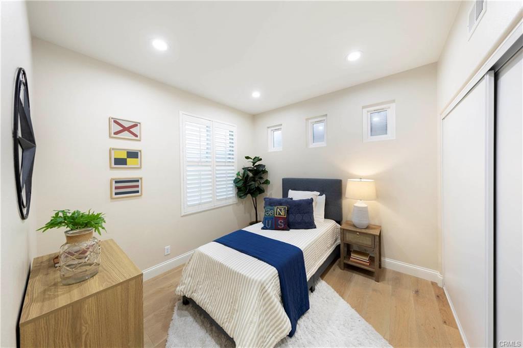 43 Lessay — secondary bedroom with vaulted ceiling and natural light