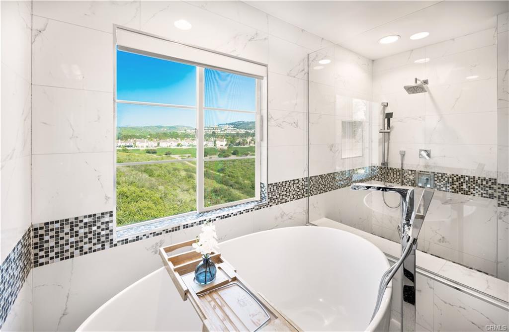 4 Chandon — spa-like primary bath with soaking tub and canyon view