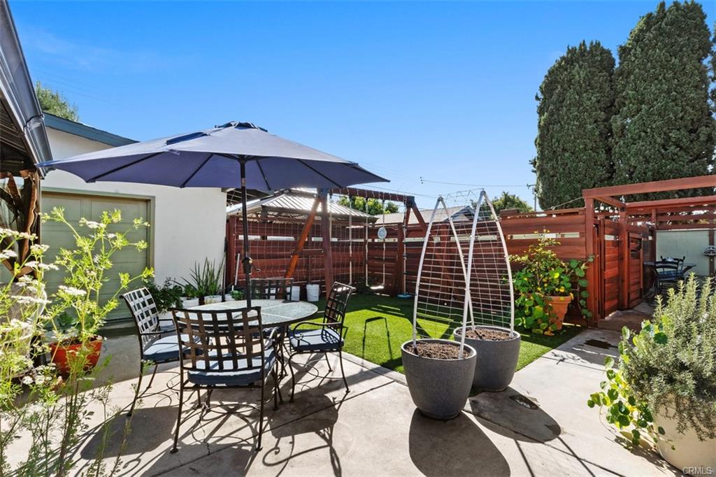 20292 Riverside Dr — covered patio and shaded outdoor seating in the rear yard