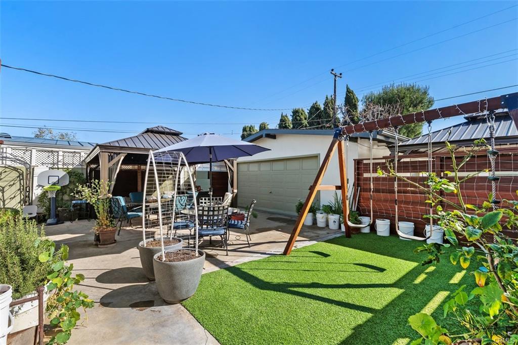 20292 Riverside Dr — fenced turf yard with covered gazebo and run areas